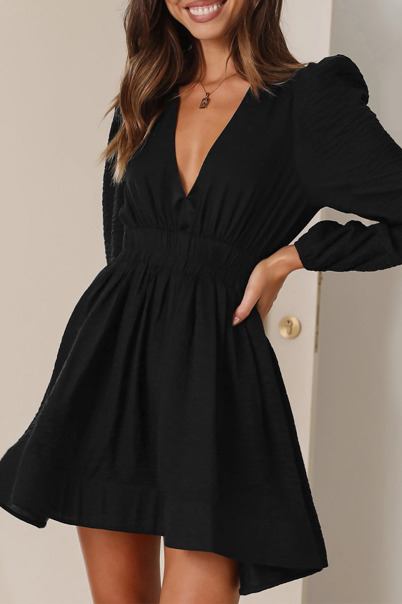 Black Lumina Vancouver Nova mini dress with v-neckline and puff sleeves, showcased on a model.