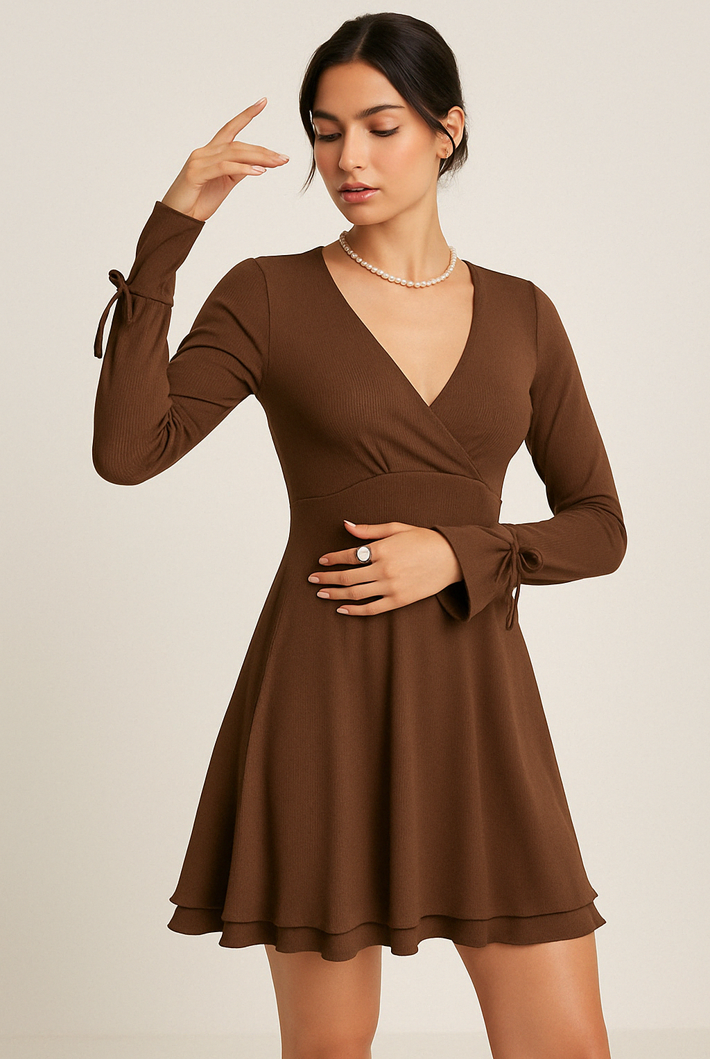 Black Gwyneth mini dress by Lumina Wear featuring flared sleeves and a deep V-neck, shown on a model.