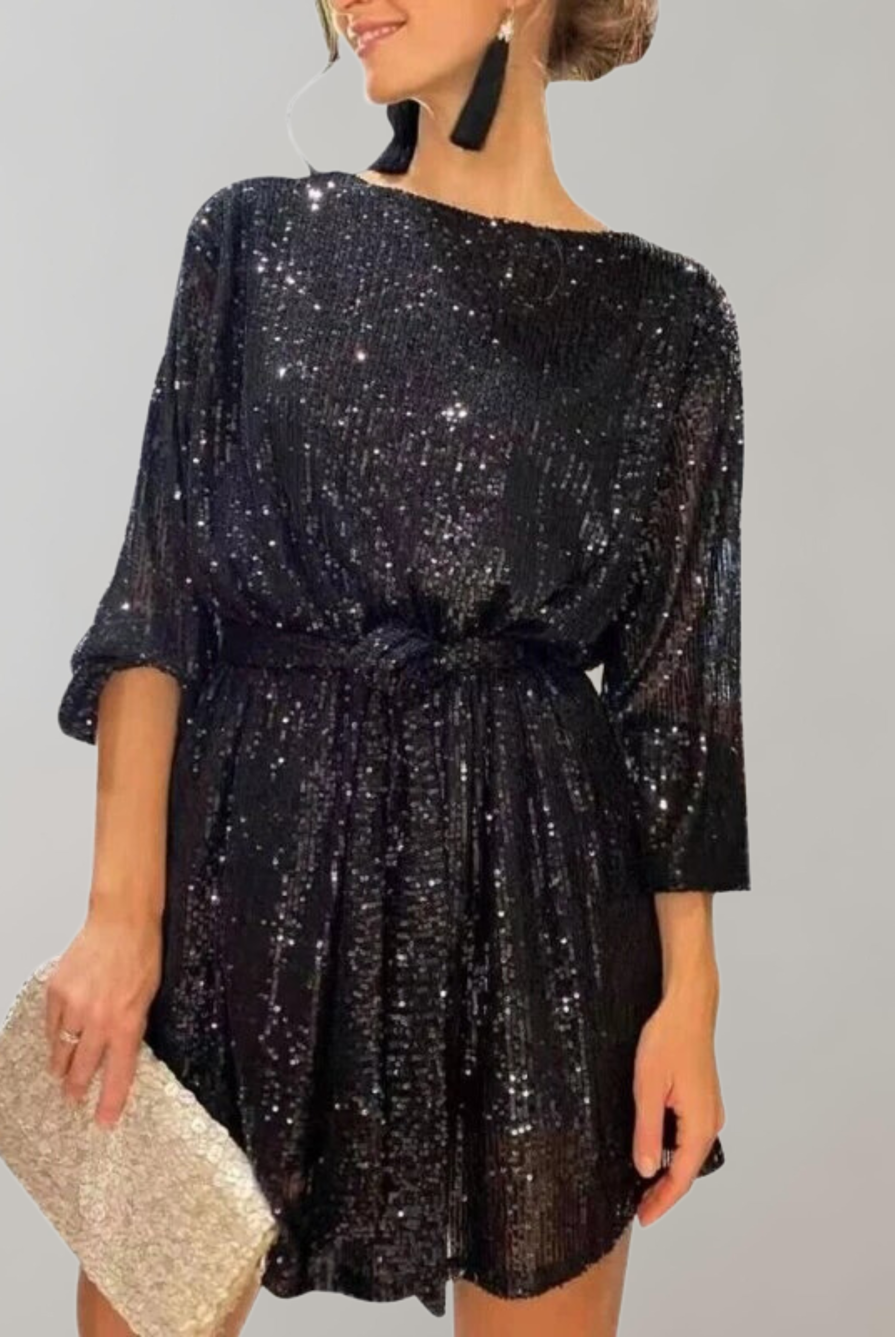 Black Nova sequin mini dress from Lumina Wear with knee-length design and matching belt, stylish and glamorous for evening wear.