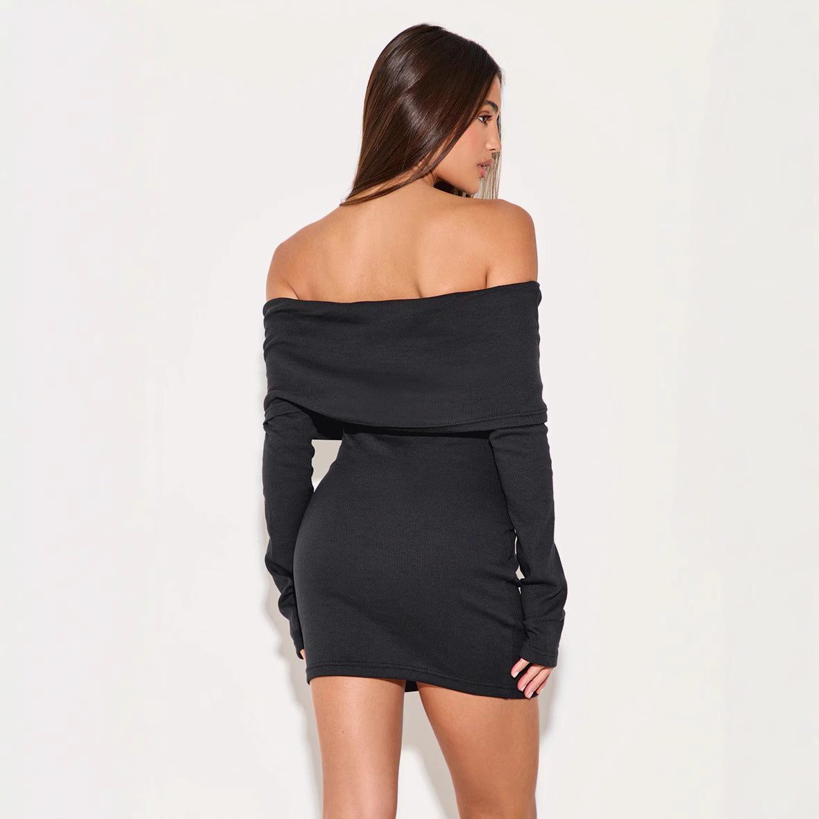 Black Novara off-shoulder mini dress by Lumina Vancouver, featuring a stylish, fitted design and short sleeves.