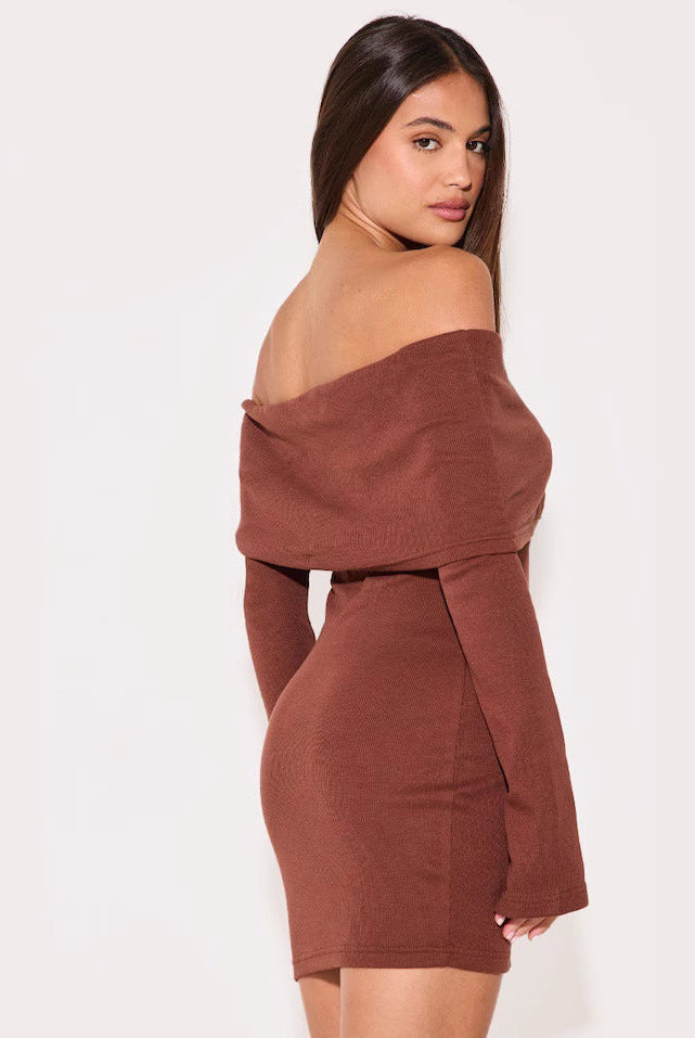 Black Novara off-shoulder mini dress by Lumina Vancouver, stylish short dress with a fitted silhouette and elegant neckline.