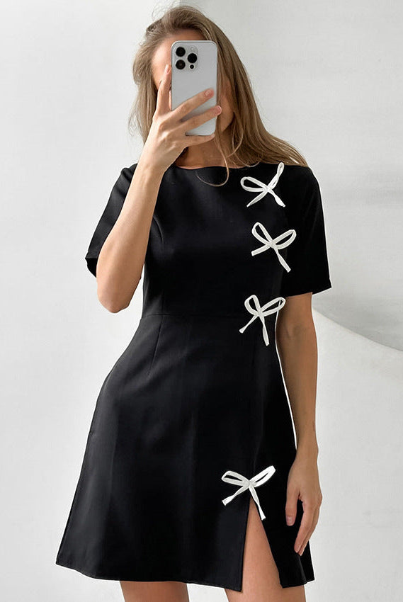 Lumina Wear Seraphine Marigold mini A-line dress in black, stylish and fitted, displayed on a mannequin.