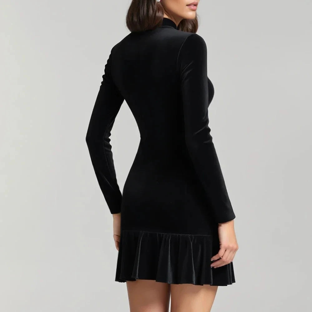 Black Willa velvet mini dress by Lumina Vancouver featuring a high neckline and fitted silhouette.