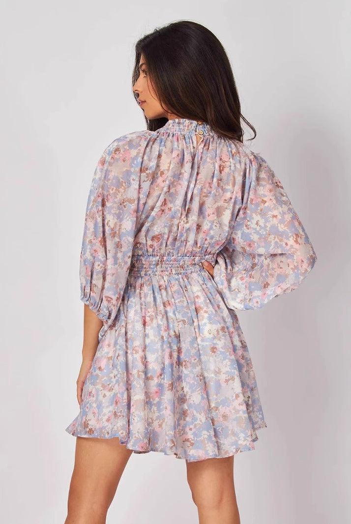 Blue Elara chiffon floral mini dress by Lumina Vancouver, featuring a short, flowy design with a delicate floral pattern.