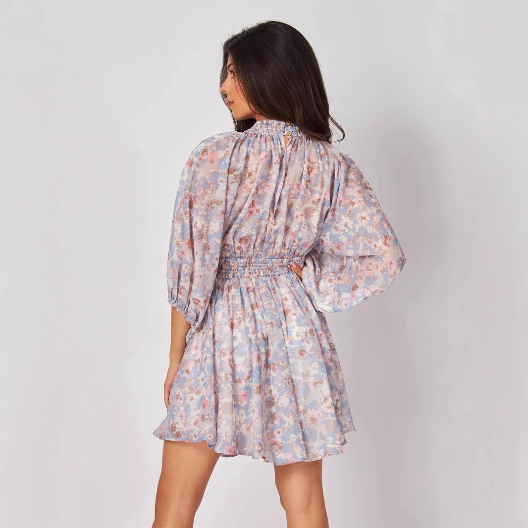 Blue Elara chiffon floral mini dress by Lumina Vancouver, featuring a short, flowy design with a delicate floral pattern.