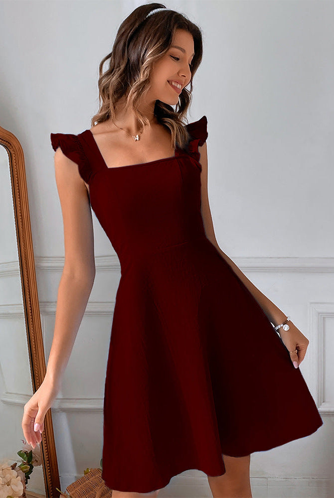 Freyja mini dress by Lumina Wear featuring a fit and flare silhouette in claret color, shown in size XS.