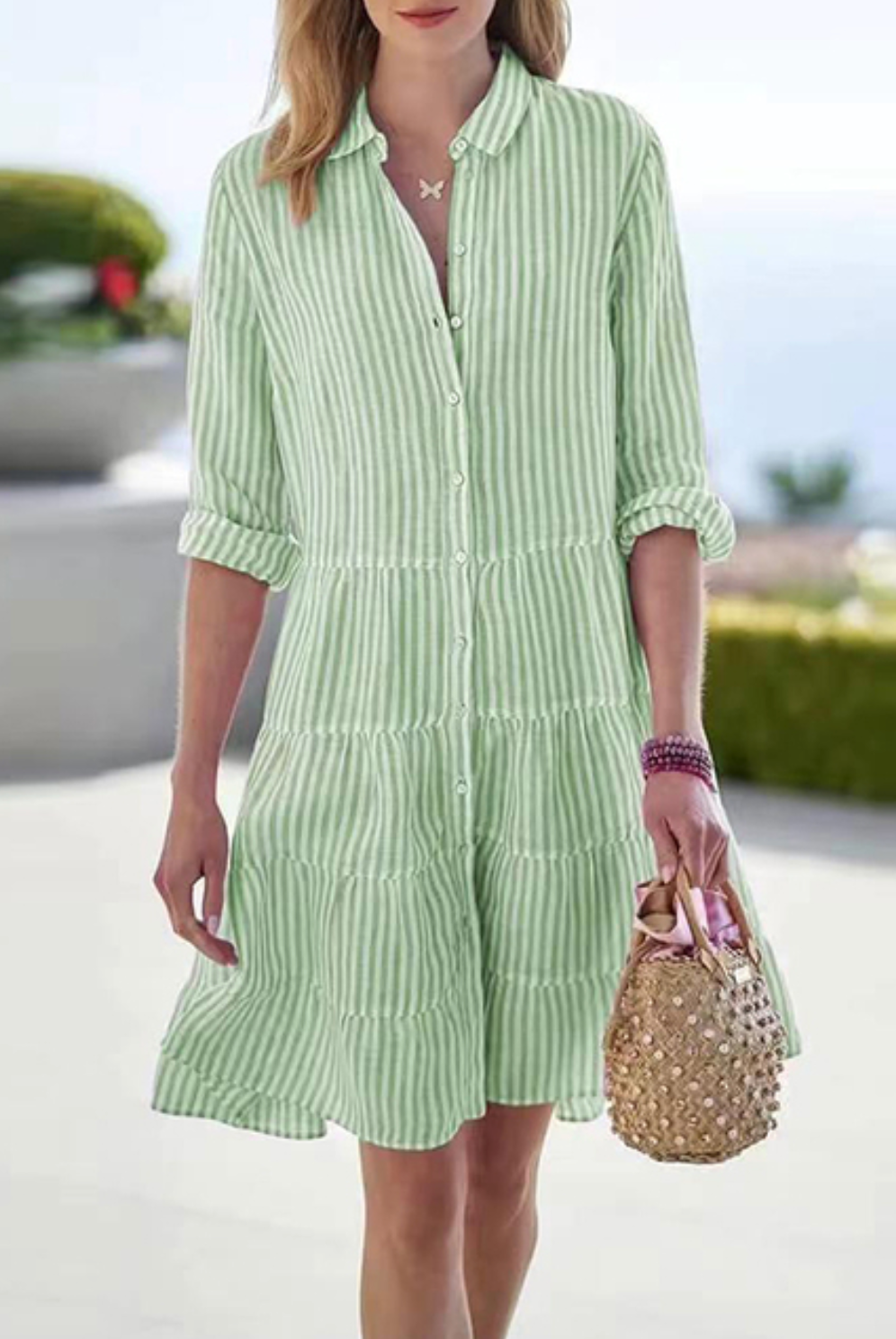 Green Astraea striped button-up mini dress by Lumina Vancouver, featuring a fitted silhouette and classic collar detail.
