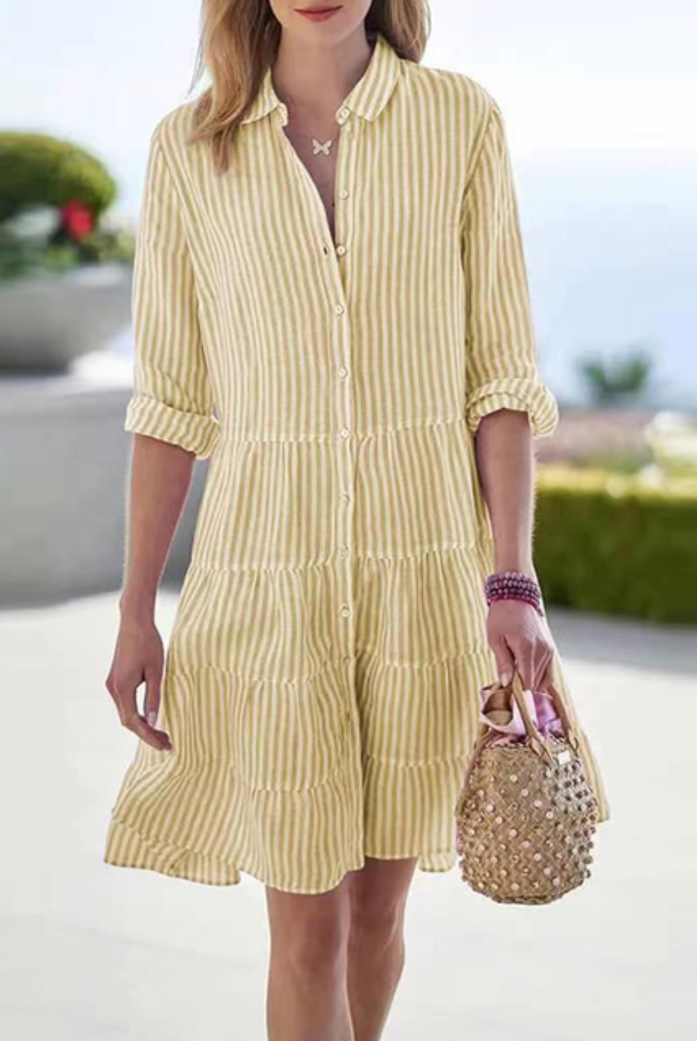 Green Astraea striped button-up mini dress by Lumina Vancouver, featuring a fitted silhouette and stylish button details.