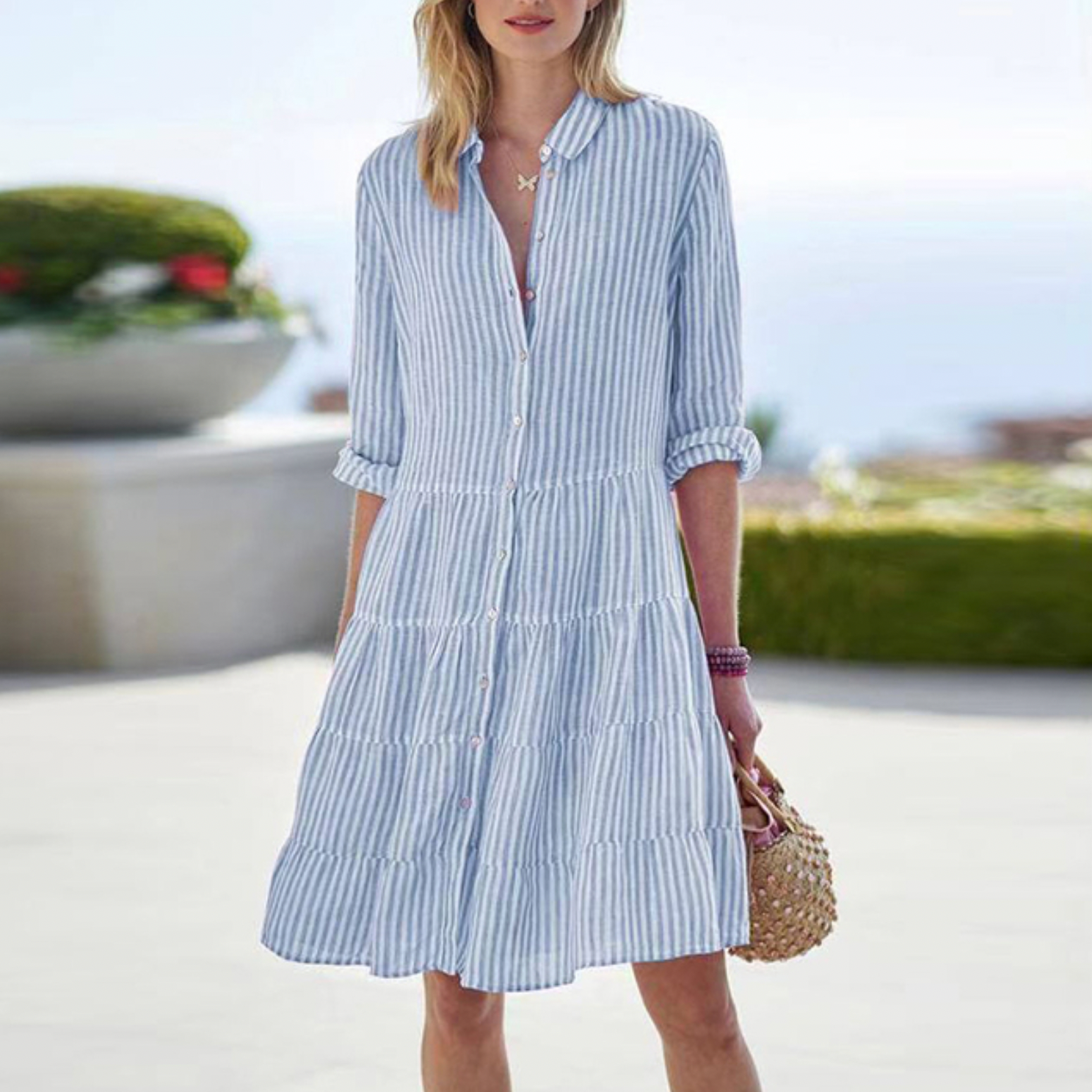 Green Astraea striped button-up mini dress by Lumina Vancouver, featuring a fitted silhouette and classic collar.