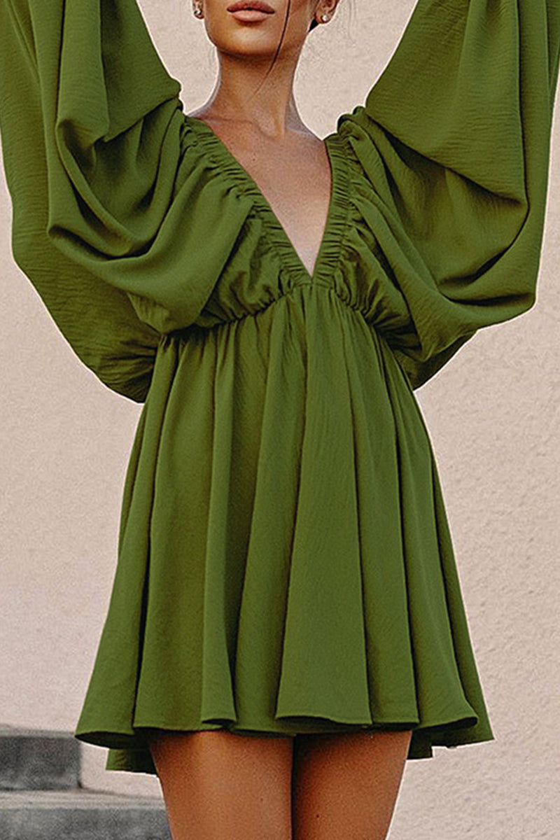 Green Camellia Lantern-Sleeve Mini Dress with deep V-neck by Lumina Vancouver, featuring flowy lantern sleeves and a fitted silhouette.