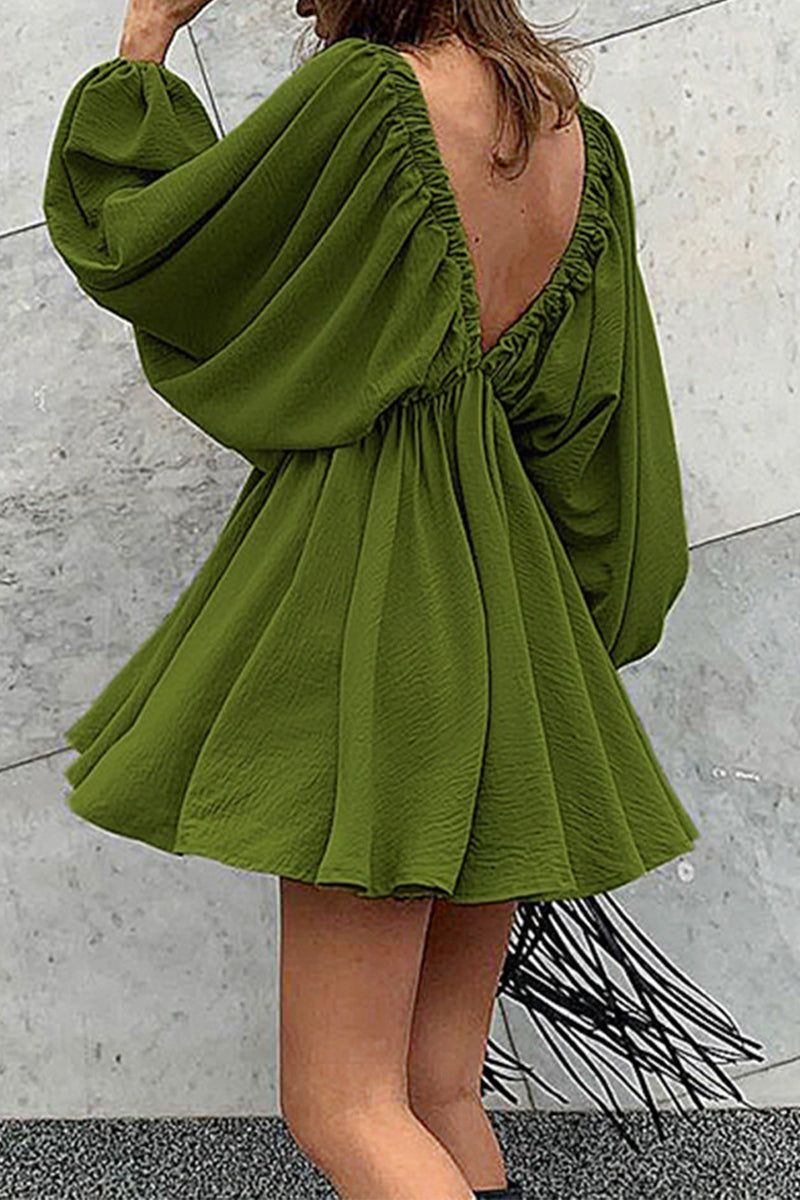 Green Camellia Lantern-Sleeve Mini Dress with deep V-neck by Lumina Vancouver, shown on a model against a neutral background.