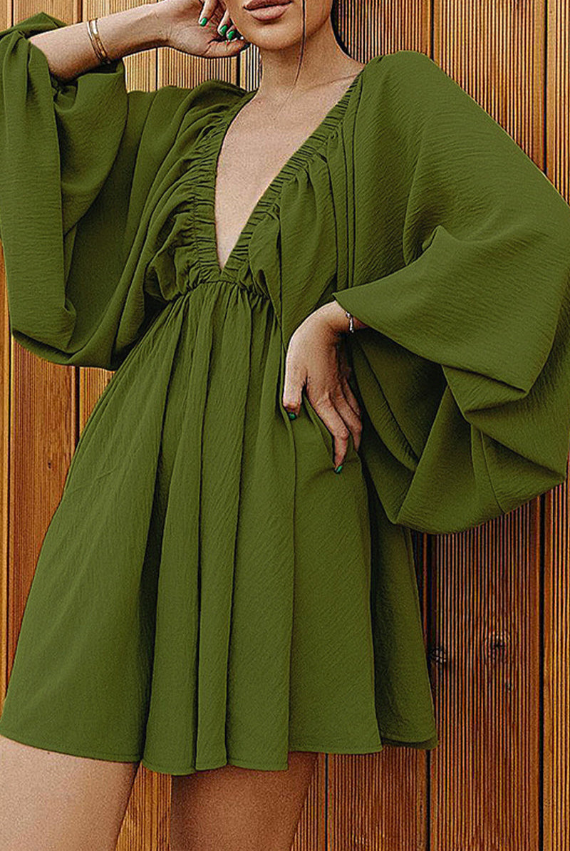 Green Camellia Lantern-Sleeve Mini Dress with deep V-neck by Lumina Wear, shown on a model, featuring elegant long lantern sleeves.