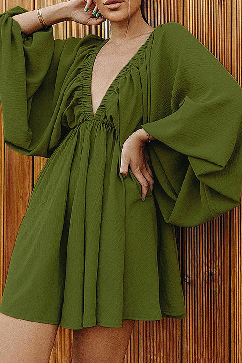 Green Camellia Lantern-Sleeve Mini Dress with deep V-neck by Lumina Vancouver, featuring flowy lantern sleeves and a fitted silhouette.