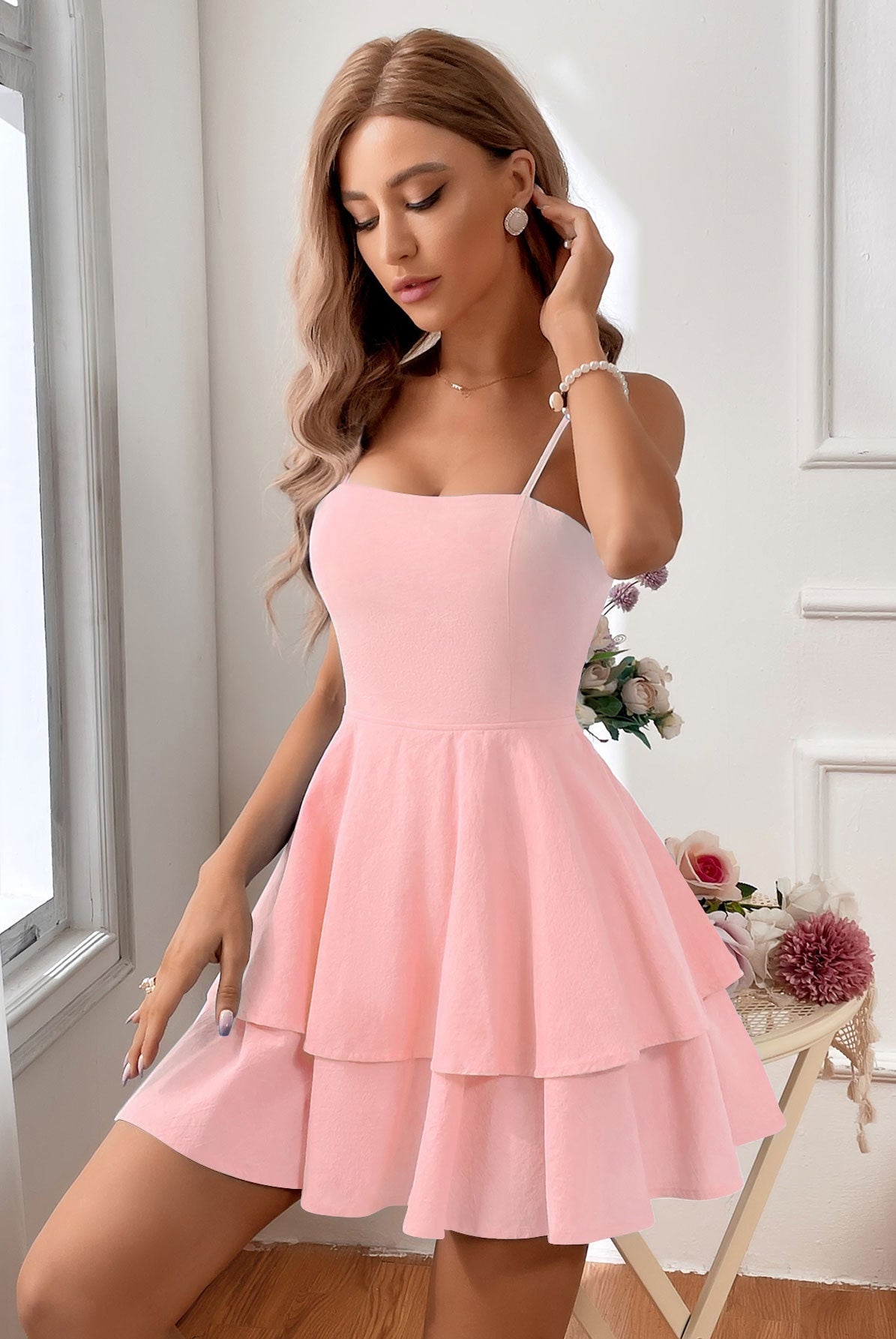 Light green Lumina Wear sleeveless mini dress from the Terhi collection, shown on a model with a fitted silhouette.