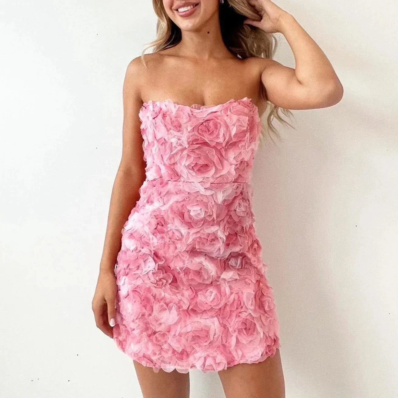 Pink Celestiana strapless mini dress by Lumina Vancouver, showcasing a fitted silhouette and elegant design.