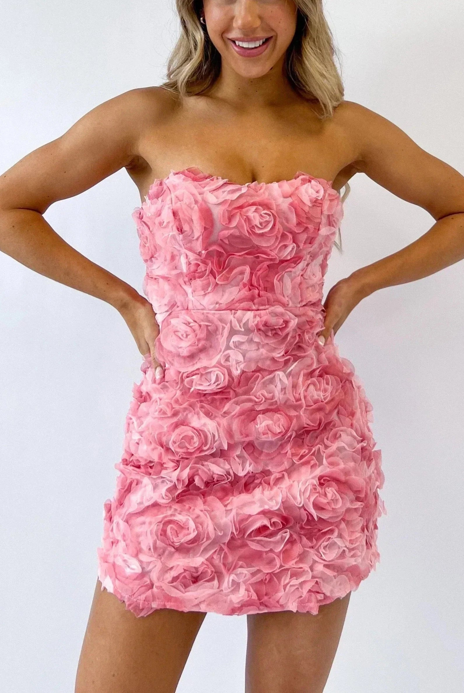 Pink Celestiana strapless mini dress by Lumina Vancouver, featuring a fitted silhouette and elegant design for stylish occasions.