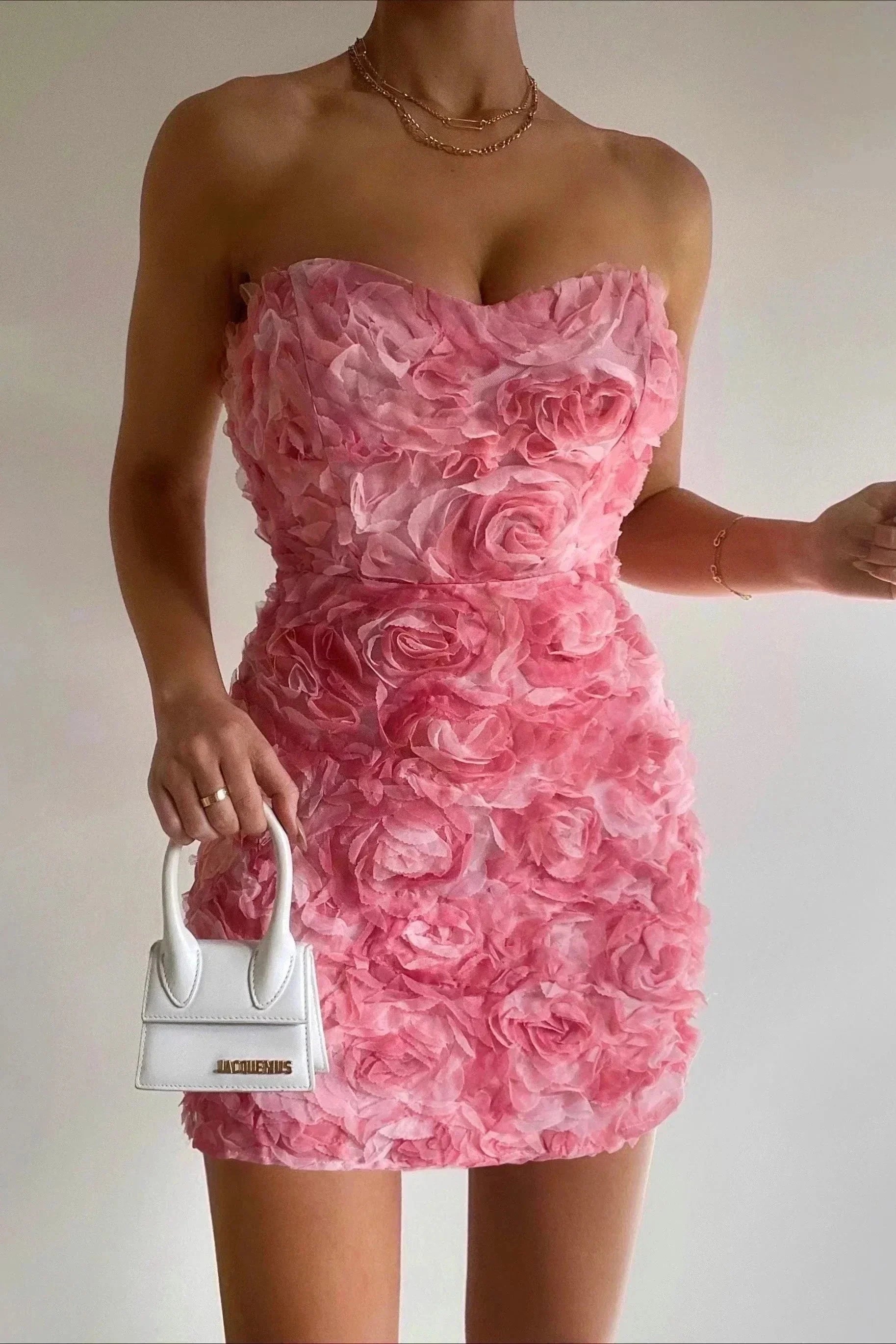 Pink Celestiana strapless mini dress by Lumina Vancouver, featuring a fitted silhouette and stylish design for a chic look.