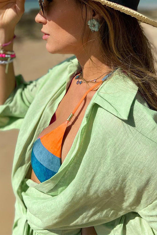 Pink Lumina Wear Tuuli Cotton Linen Wrap Mini Dress with a fitted waist and short sleeves, styled for casual occasions.