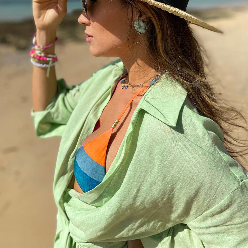 Pink Lumina Vancouver Tuuli Cotton Linen Wrap Mini Dress with long sleeves and adjustable waist for a stylish, comfortable look.