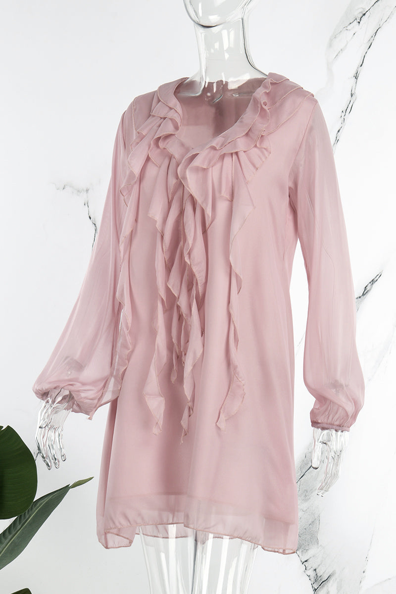 Pink knee-length flowy dress with V-neck from Lumina Vancouver, featuring a mini dress style and elegant, lightweight fabric.