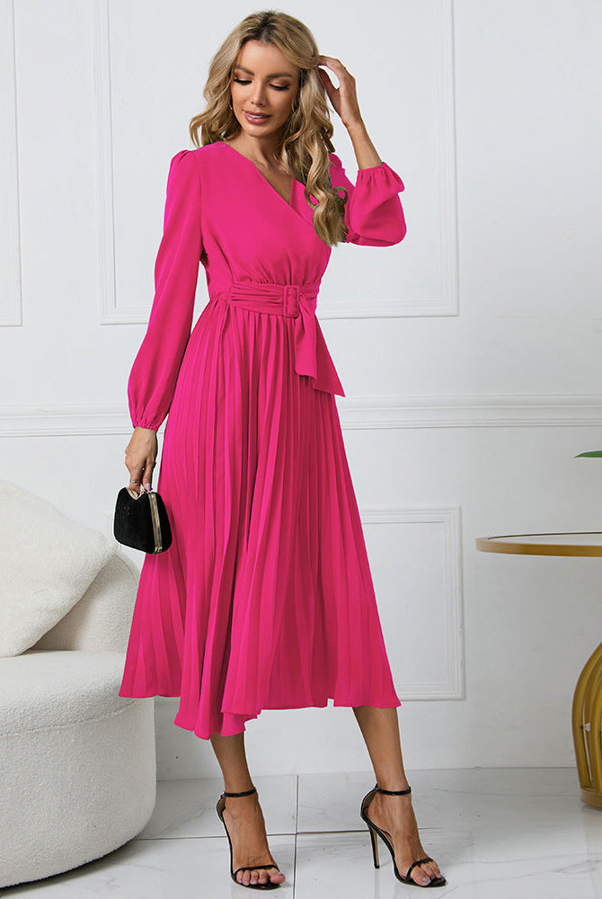 Pink long-sleeved V-neck pleated mini dress from Lumina Wear's Nova collection, featuring a stylish and elegant design.