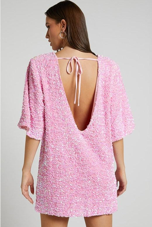 Lumina Wear Isolde pink mini dress with plunge back and sequin embellishments, featuring a fitted silhouette and stylish design.