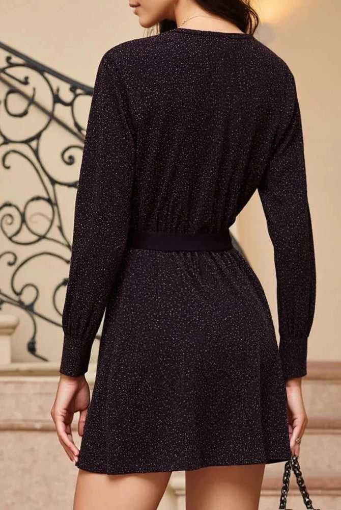 Purple Lumina Wear Nova Glimmer Shimmer mini dress, sleeveless with a fitted silhouette, shown on a model.