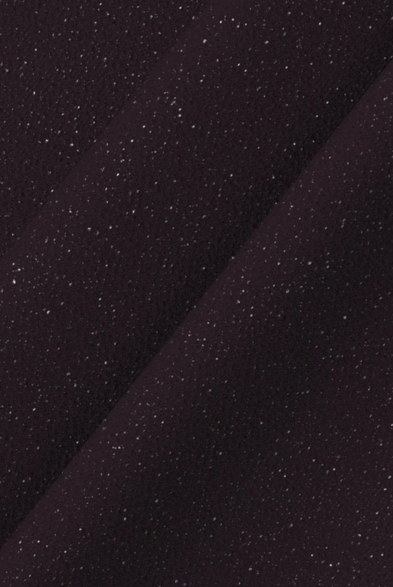 Lumina Vancouver Nova Glimmer Shimmer mini dress in purple, showcasing its sparkling fabric and stylish fit.