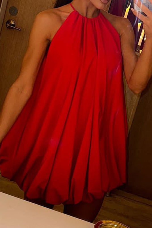 Red Wilma Celeste halter mini dress by Lumina Wear, shown on a model with a fitted silhouette and stylish design.