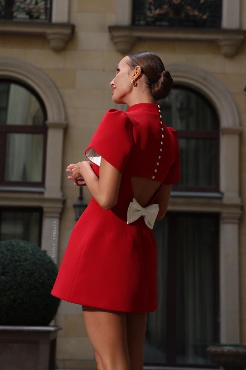 Red Nova Lumina mini dress with tailored fit, open back, and bow detail, perfect for stylish occasions.