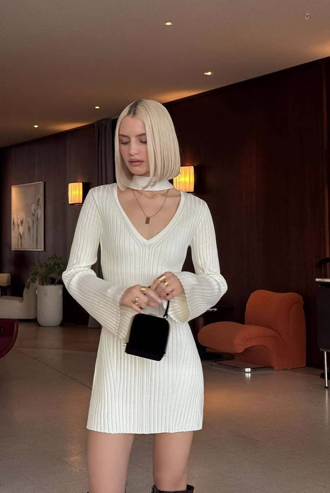 White Lumina Wear Aurora ribbed knit mini dress, close-up showing fitted silhouette and elegant texture.