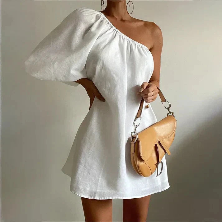 White Godeliève one-shoulder mini dress by Lumina Vancouver, featuring a sleek and stylish design, perfect for elegant occasions.