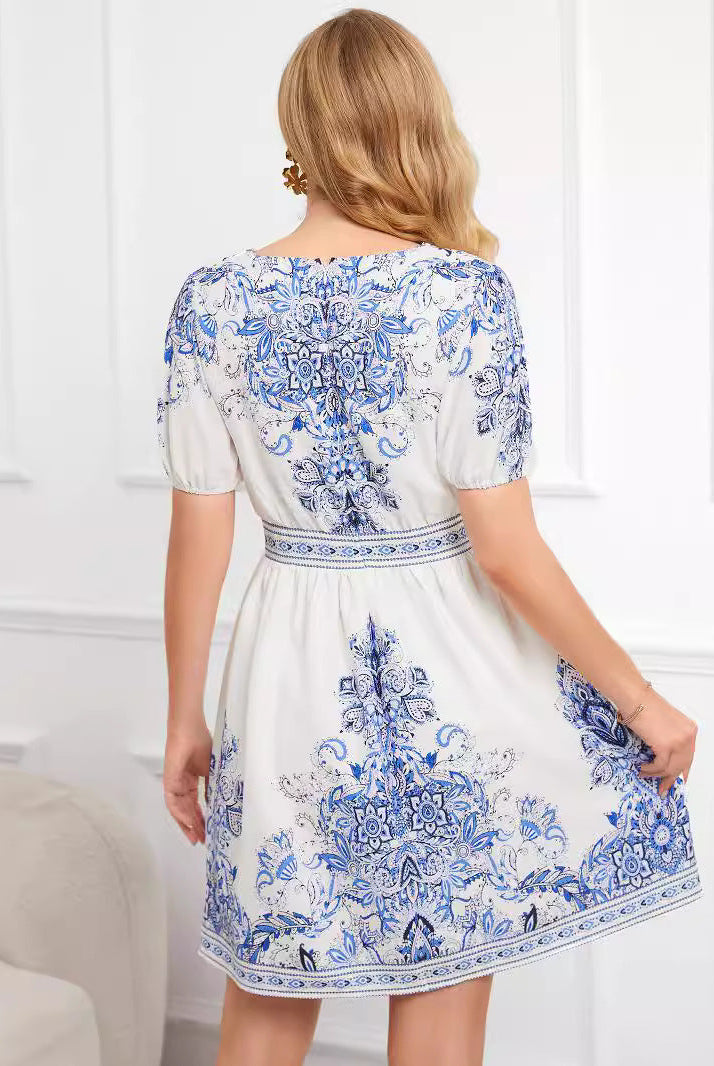White printed cotton mini dress by Lumina Wear, featuring a stylish, lightweight design perfect for casual wear.