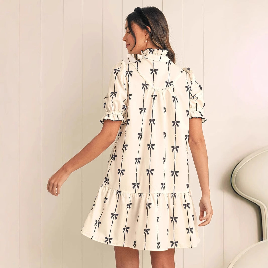 White Elara Cotton Bow Daydream A-Line Mini Dress by Lumina Vancouver, featuring a bow detail and elegant fit.