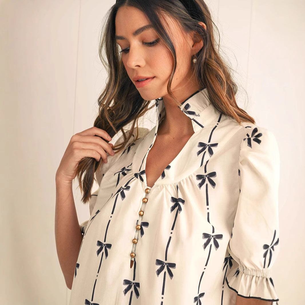 White Elara Cotton Bow Daydream A-Line Mini Dress by Lumina Vancouver, featuring a bow detail and flattering silhouette.