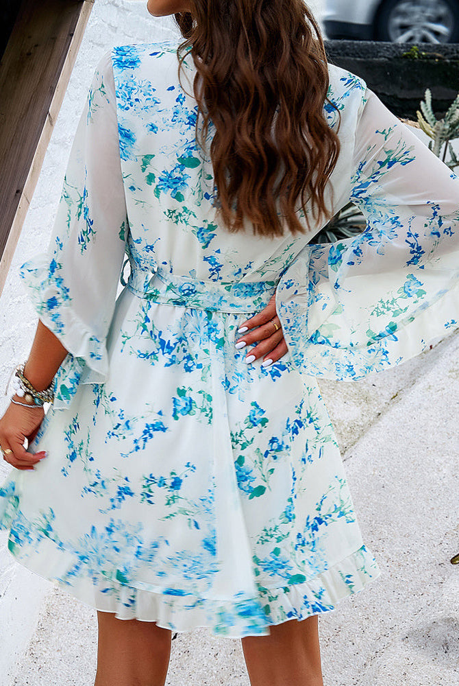 Women's floral V-neck mini dress by Lumina Wear, white with a feminine design, perfect for casual or semi-formal occasions.