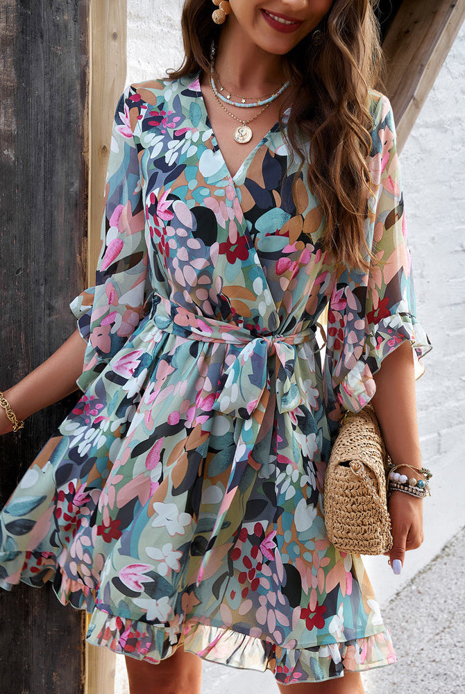 Lumina Wear Alba women's floral V-neck mini dress in white, featuring a feminine V-neckline and lightweight fabric.