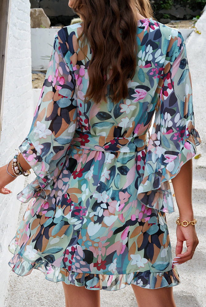 Lumina Wear Alba women's floral V-neck mini dress in white, with a fitted silhouette and feminine floral pattern.