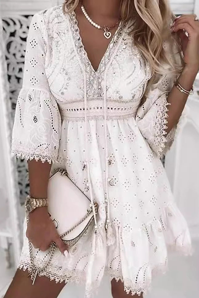 White Isadora Moonlight Muse V-neck mini dress by Lumina Vancouver, showcased on a mannequin.