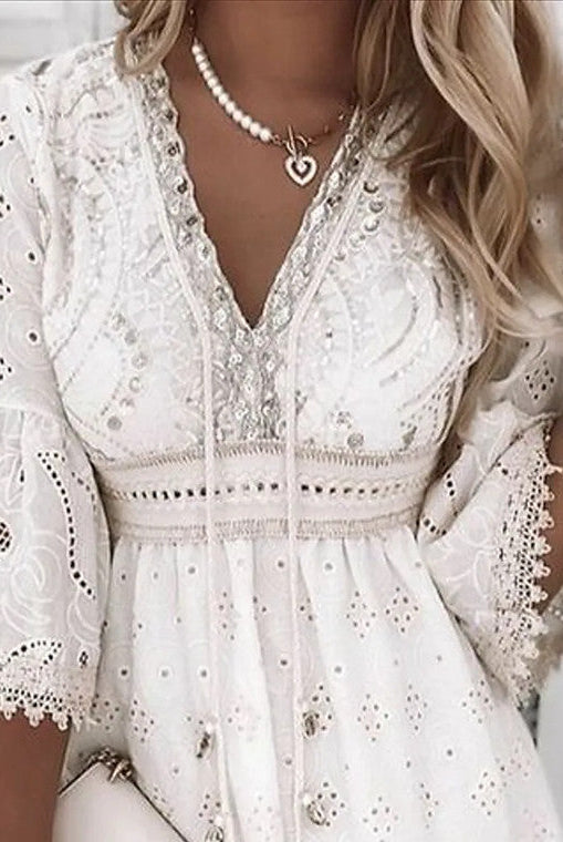 White Isadora Moonlight Muse V-neck mini dress by Lumina Vancouver, featuring a stylish V-neckline and elegant design.