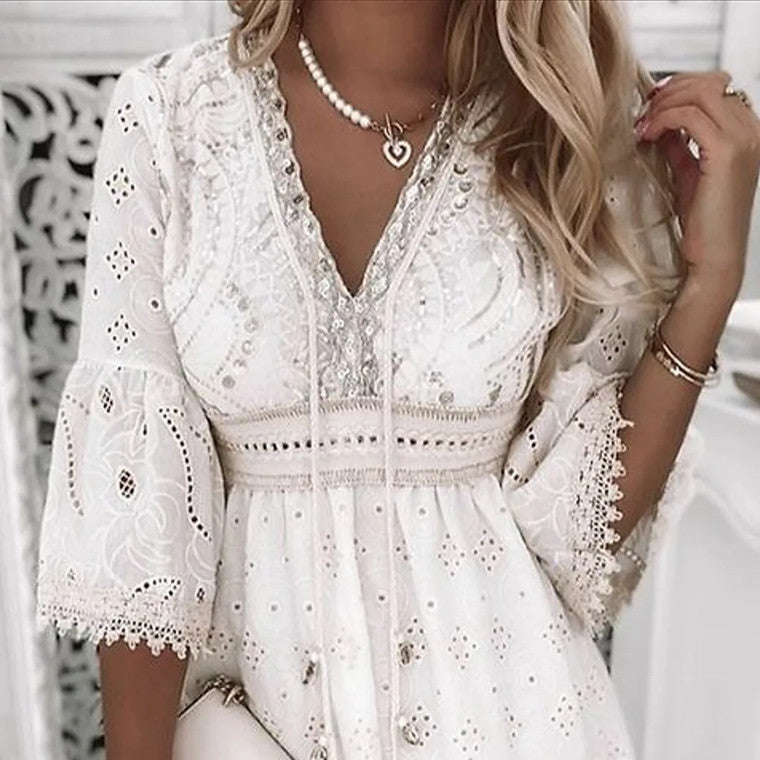 White Isadora Moonlight Muse V-neck mini dress by Lumina Vancouver, featuring a stylish V-neckline and elegant design.