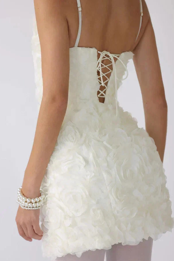 Lumina Wear Honoria mini dress featuring a 3D floral textured fabric in white, displayed on a mannequin.
