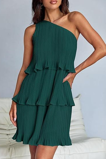 White Nova pleated one-shoulder mini dress by Lumina Vancouver, showcasing elegant draped fabric and stylish asymmetric design.