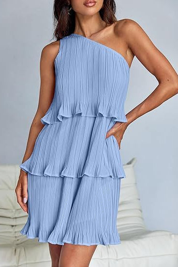 White Nova pleated one-shoulder mini dress by Lumina Vancouver, shown on a mannequin with a stylish elegant design.