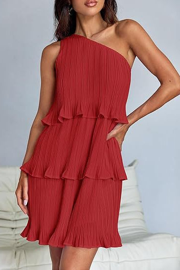 White Nova pleated one-shoulder mini dress by Lumina Vancouver, featuring elegant draping and a stylish silhouette.