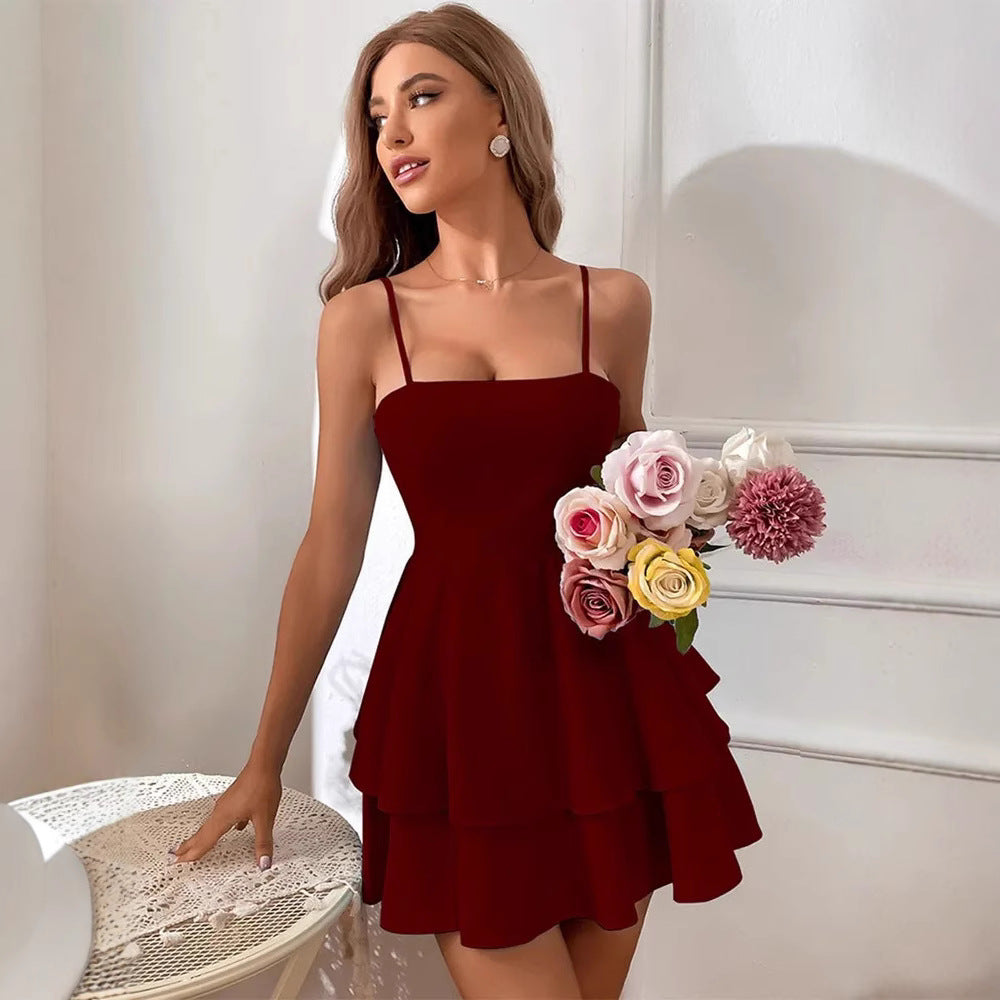White Noemie mini dress by Lumina Vancouver with spaghetti straps, featuring a stylish and fitted design for warm weather.