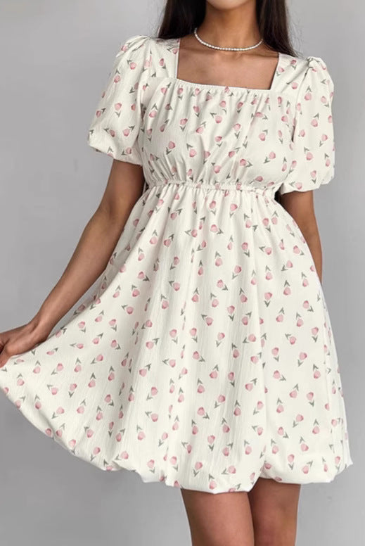 Seraphina floral mini A-line dress by Lumina Vancouver, white with colorful flower print, sleeveless design, perfect for summer.