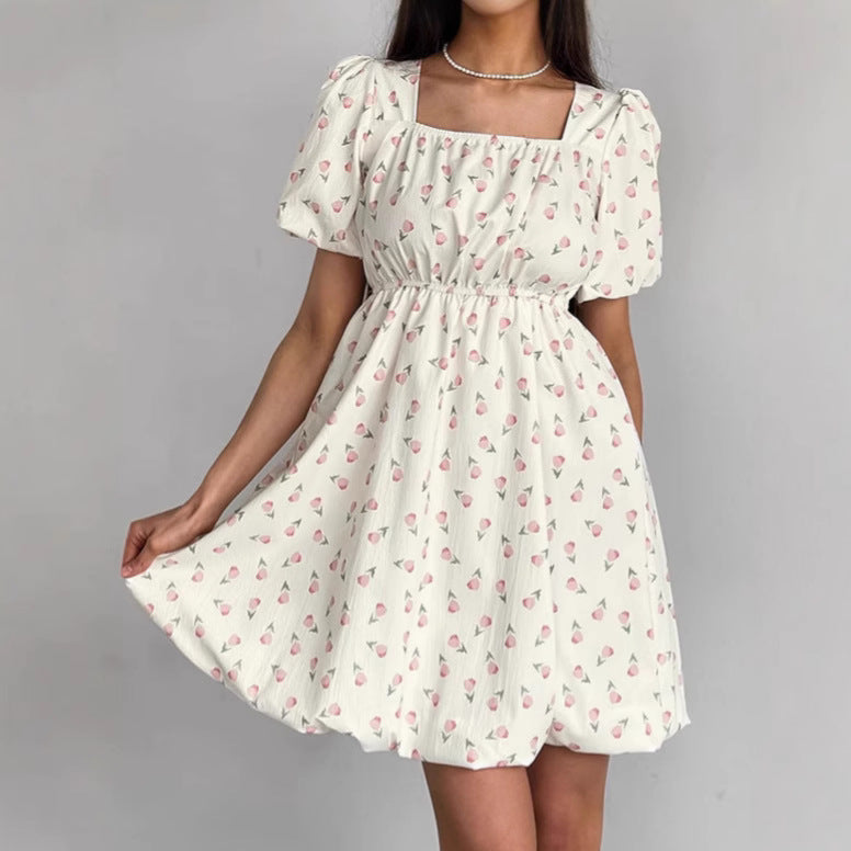 Seraphina floral mini A-line dress by Lumina Vancouver, white with colorful flower print, sleeveless design, perfect for summer.