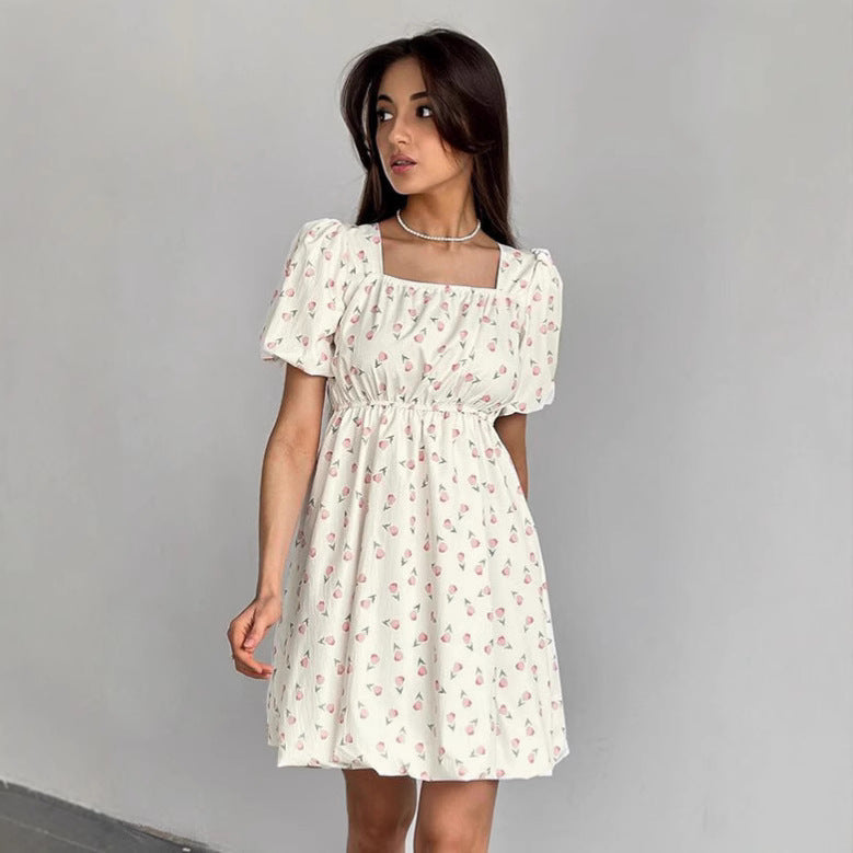 Seraphina floral mini A-line dress by Lumina Vancouver, white with colorful flower print, lightweight and stylish for summer wear.