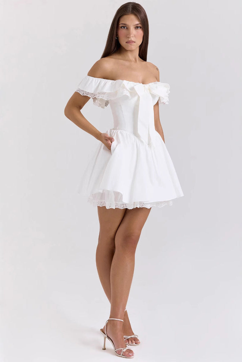 White Nova off-shoulder mini dress with A-line fit by Lumina Vancouver, styled on a model, showcasing elegant summer fashion.